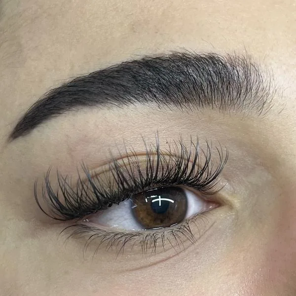 Dense volume eyelash extensions on brown eyes